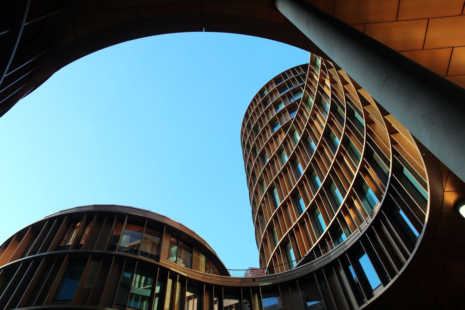 Curved facade of a contemporary building.